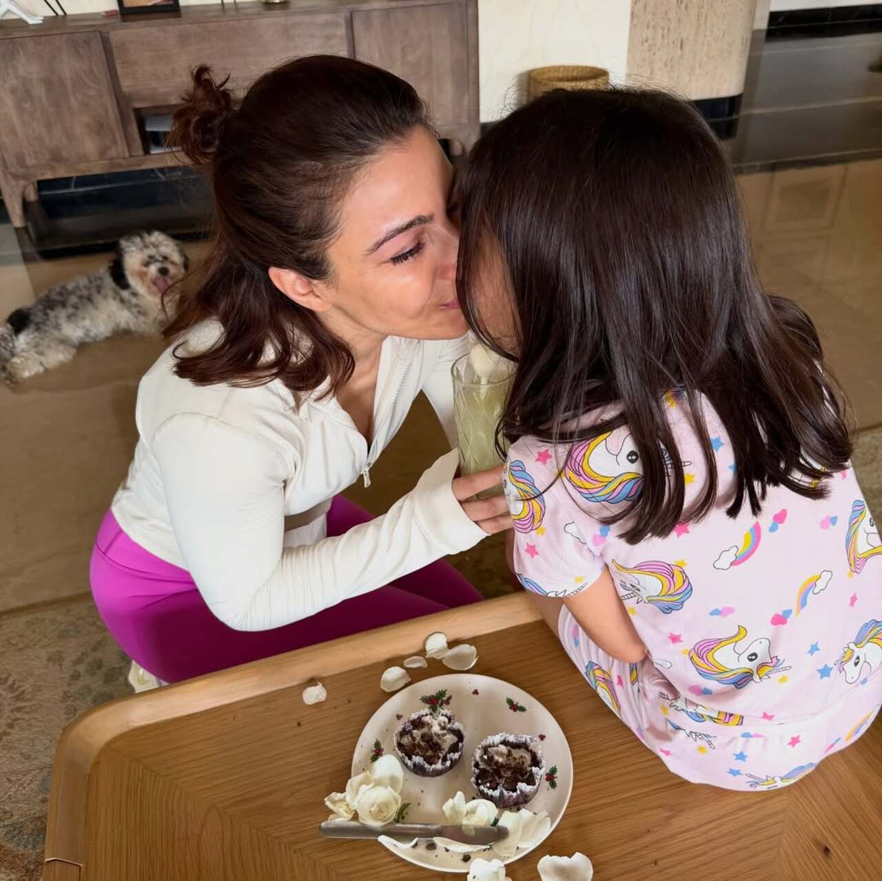 <p>Soha`s birthday dump began with an adorable picture of her and her daughter sharing her kiss while cutting her birthday cake</p>
